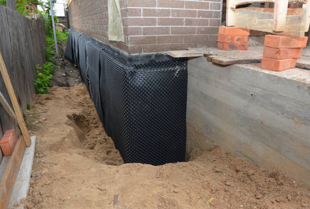Happy homeowners after waterproofing job in Germantown
